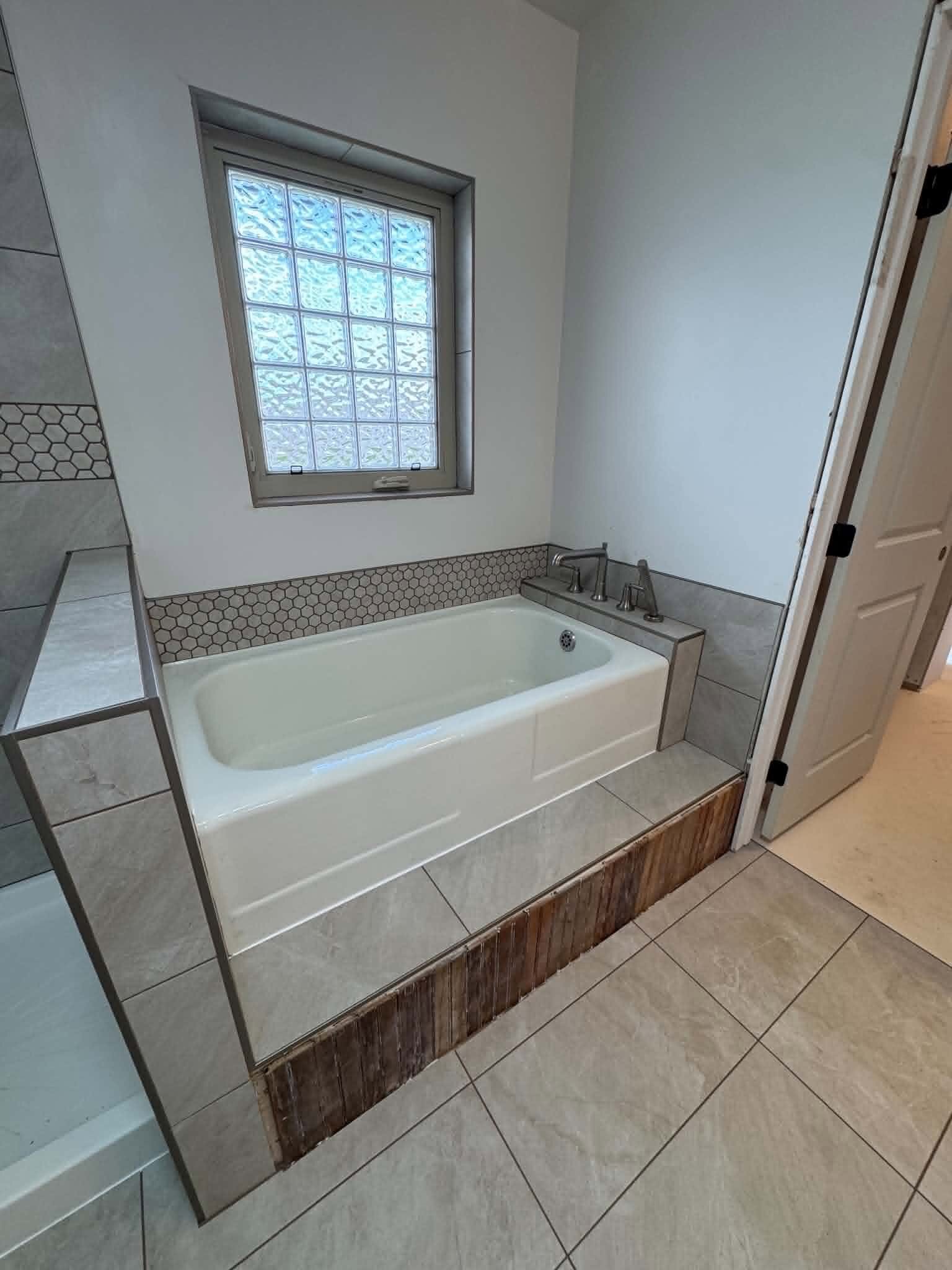 Tiled tub surround installed by MG Flooring