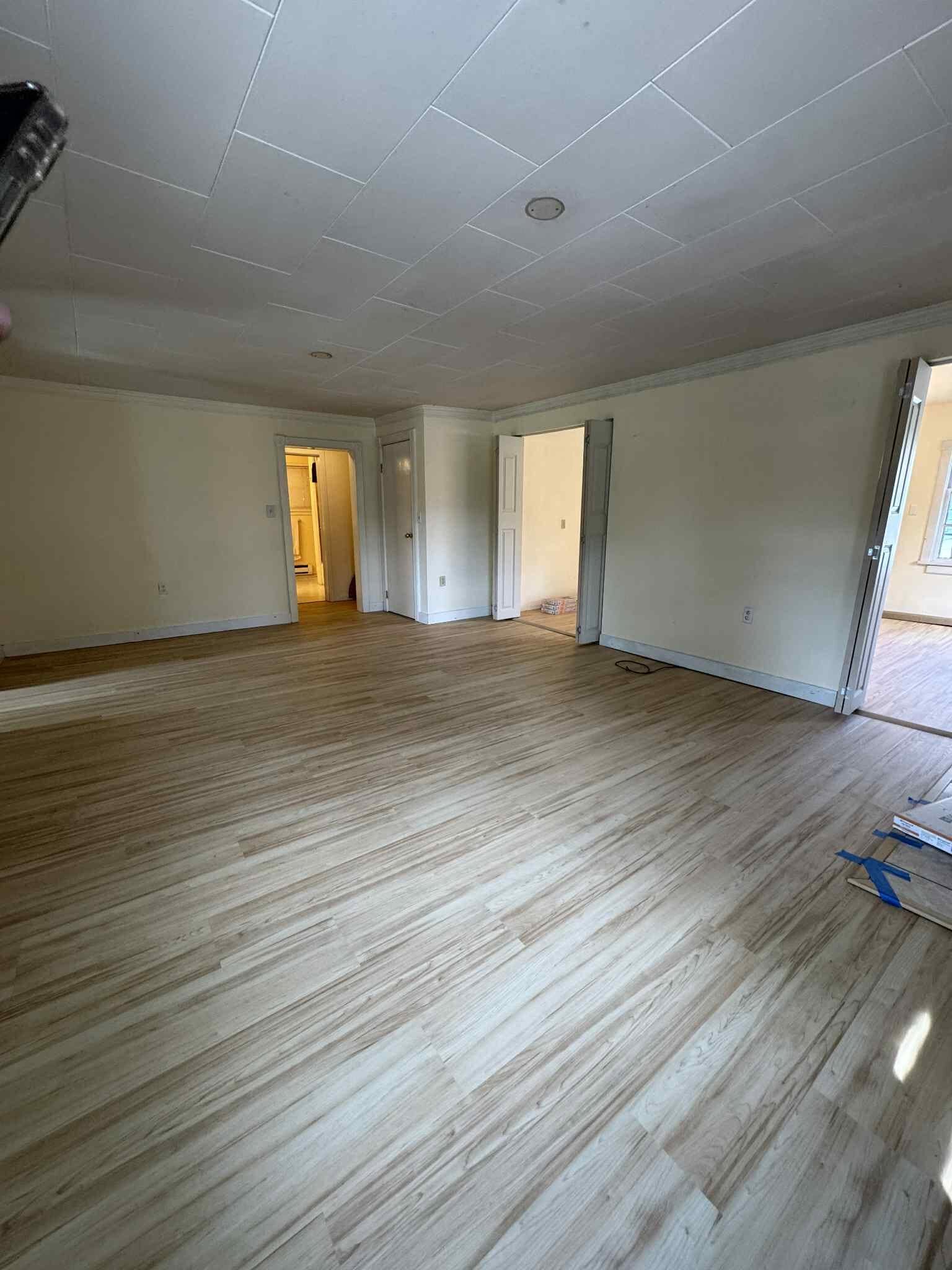 Open living space with luxury vinyl plank flooring installed by MG Flooring
